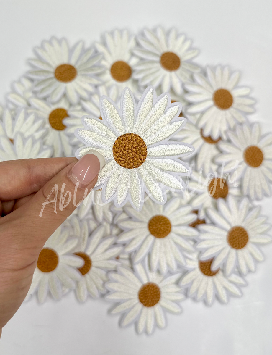 Embroidered White Daisy Patch with Yellow Center on Textured White