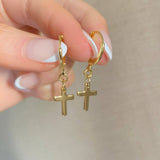Gold cross charm earrings