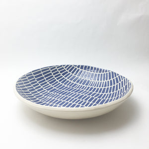 Large carved blue and white serving bowl
