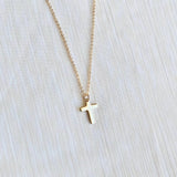 Dainty gold cross necklace