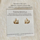 Gold cross charm earrings